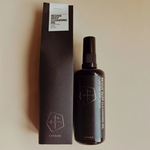 Revive Detox Cleansing Oil bottle and packaging on a beige background