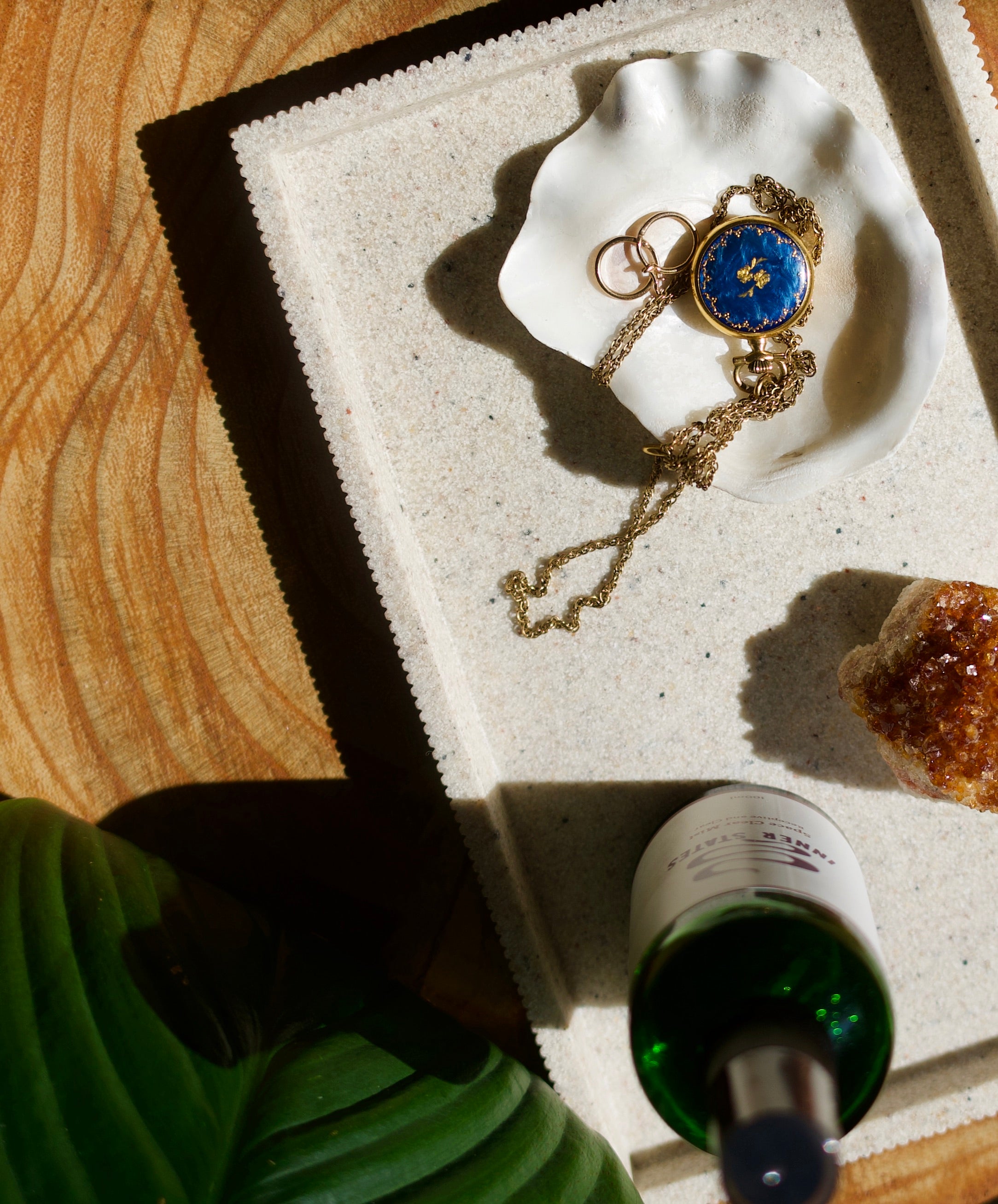 Margot Body Studio wooden side table [antique necklace, aroma room mist and citrine crystal]