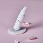 MV Skintherapy Rose Hydrating Mist with rose petals in background- Margot Body
